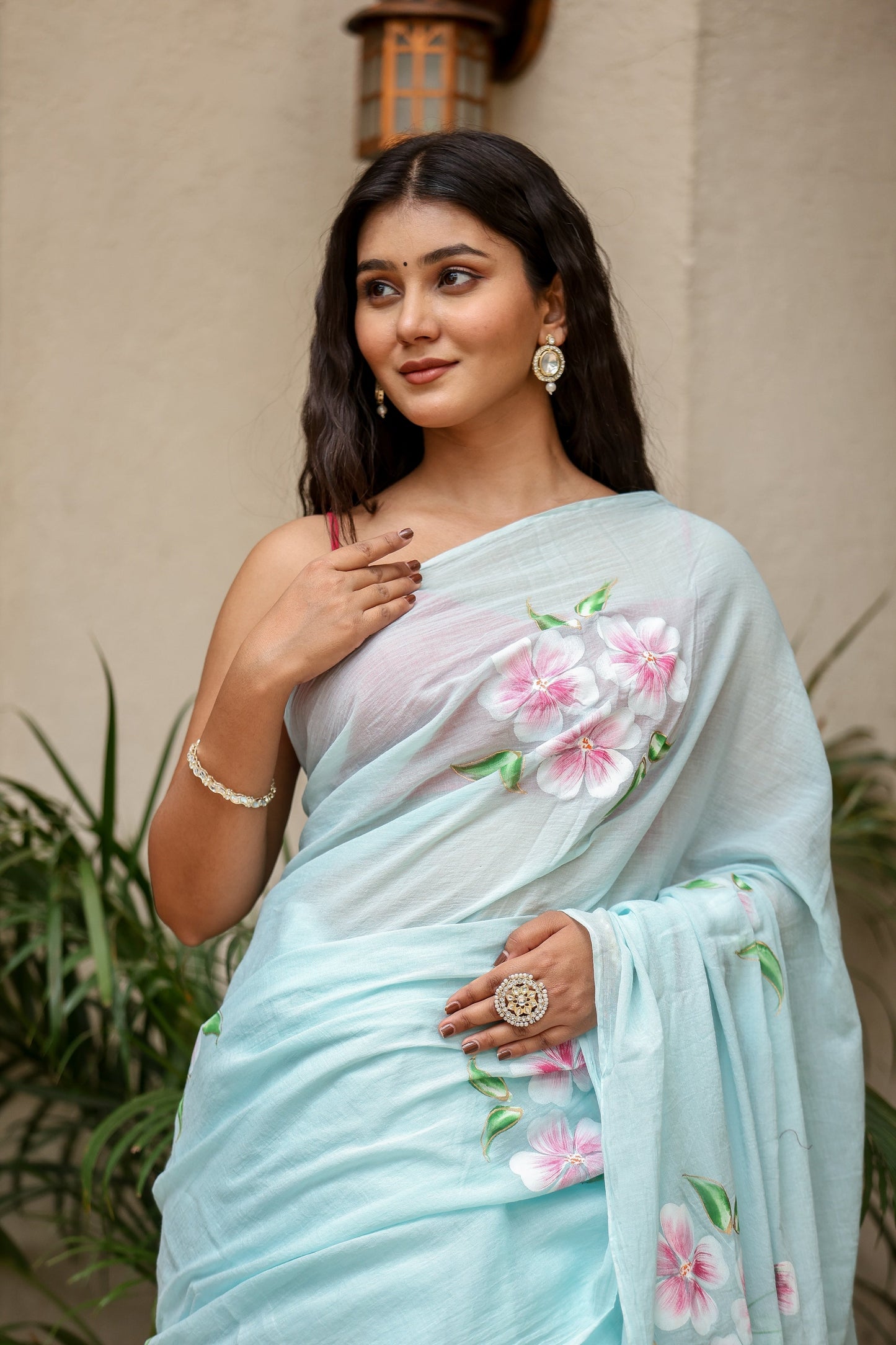 Elegant blue saree with floral embroidery, perfect for parties and unique designer sarees for parties.