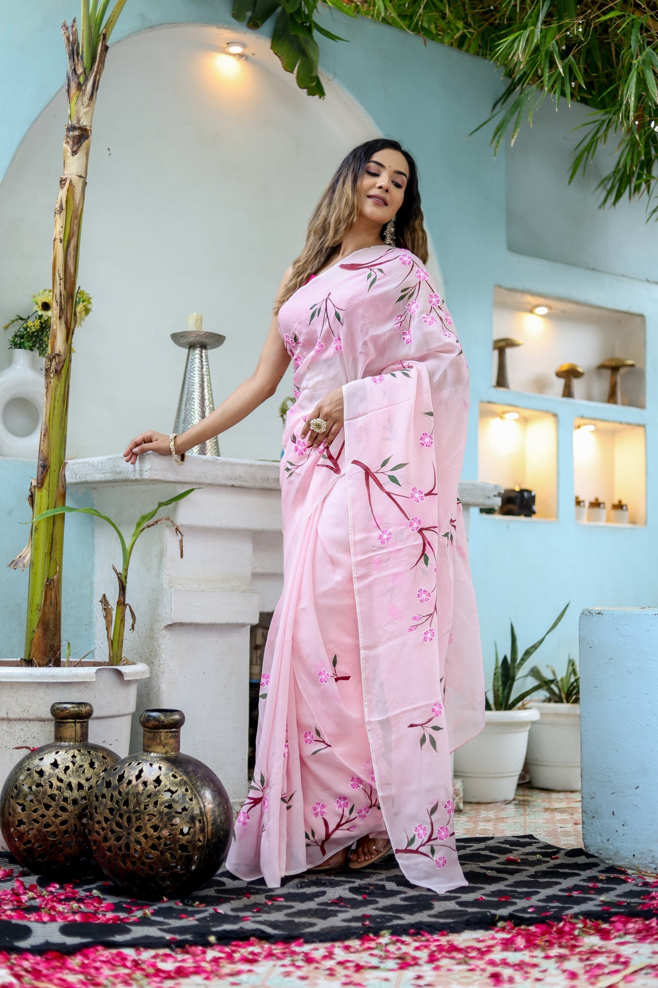 Elegant pink unique handpainted saree for weddings featuring floral designs, perfect for special occasions