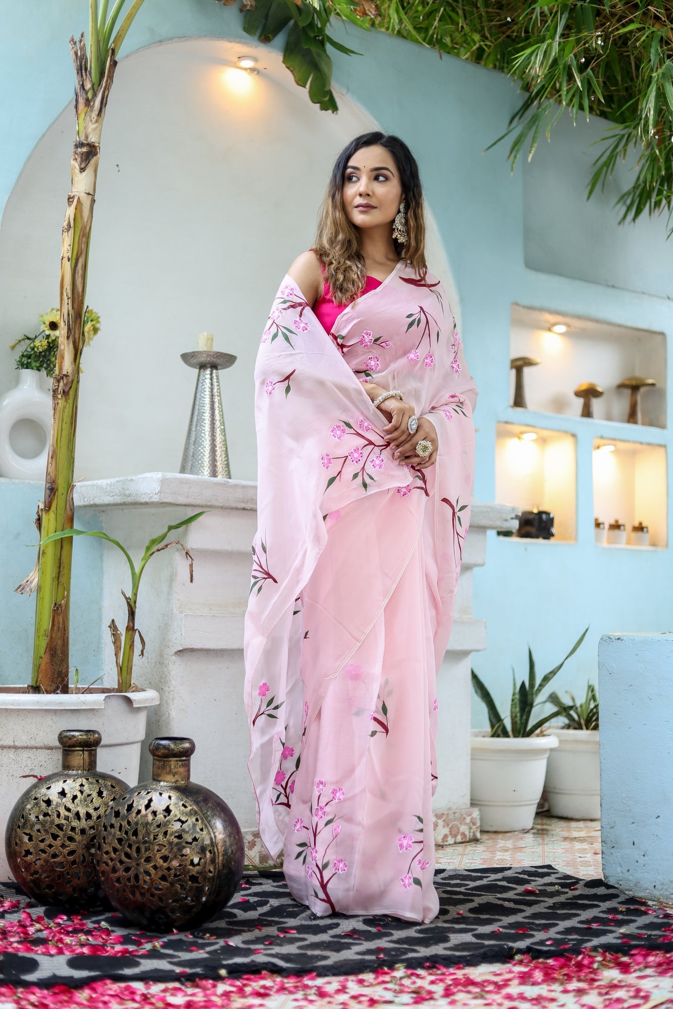 Stylera unique handpainted saree for weddings in soft pink with floral designs and elegant draping