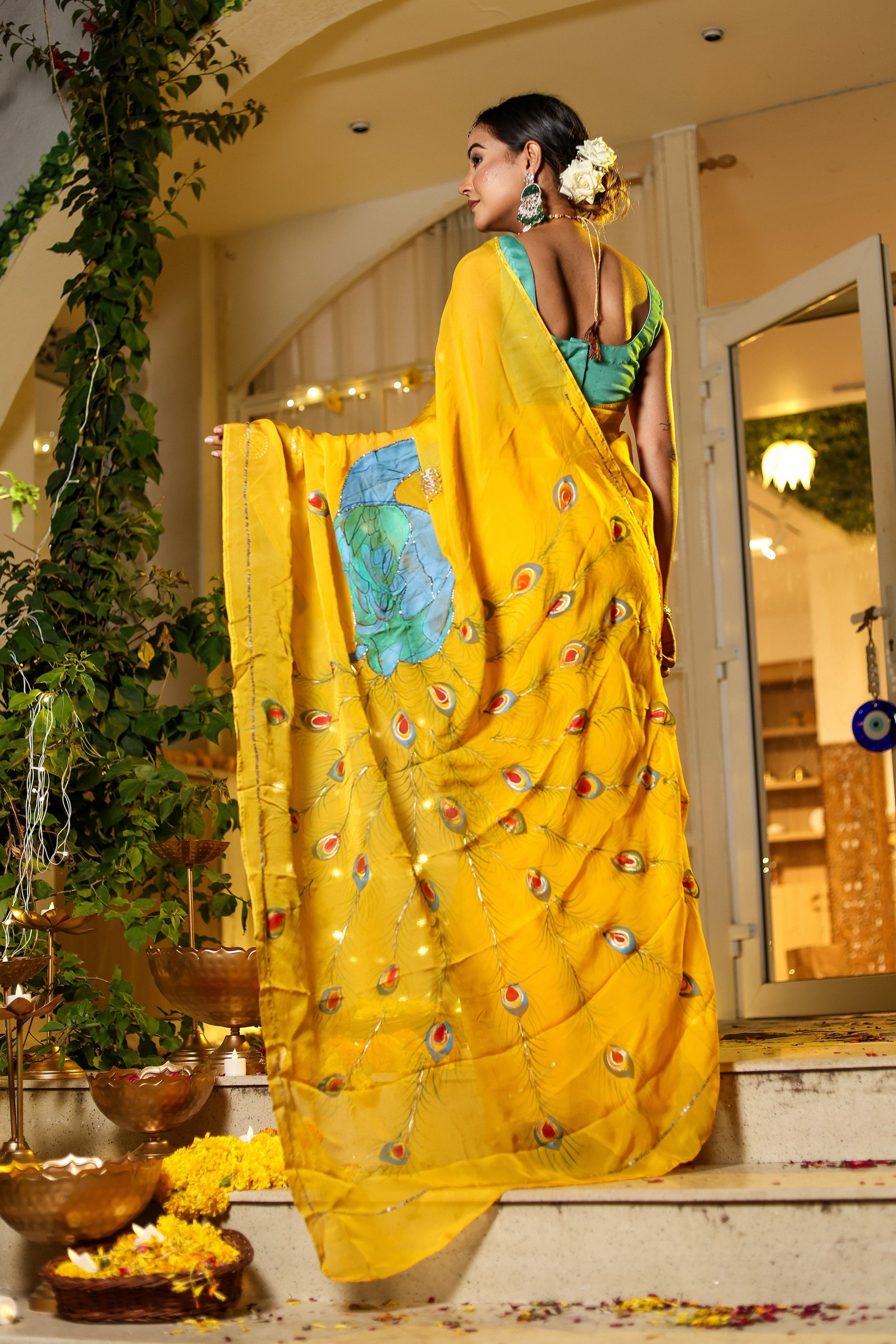 Unique Indian saree with embroidery in vibrant yellow, showcasing intricate designs on soft fabric