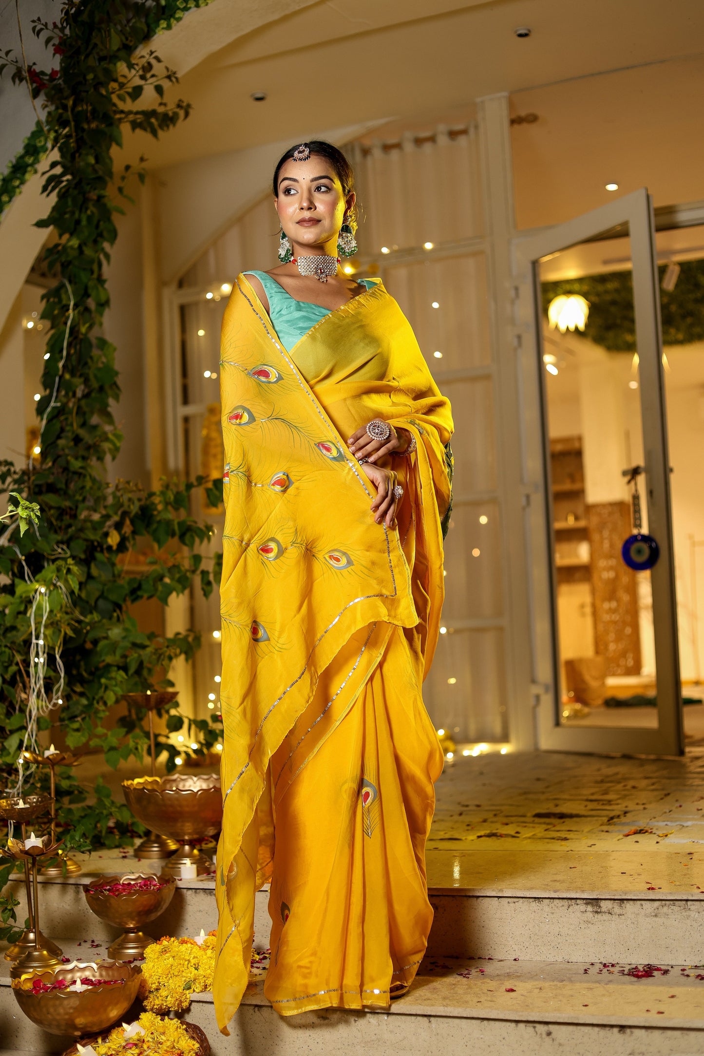 Beautiful model wearing a unique Indian saree with embroidery in vibrant yellow, styled elegantly for special occasions