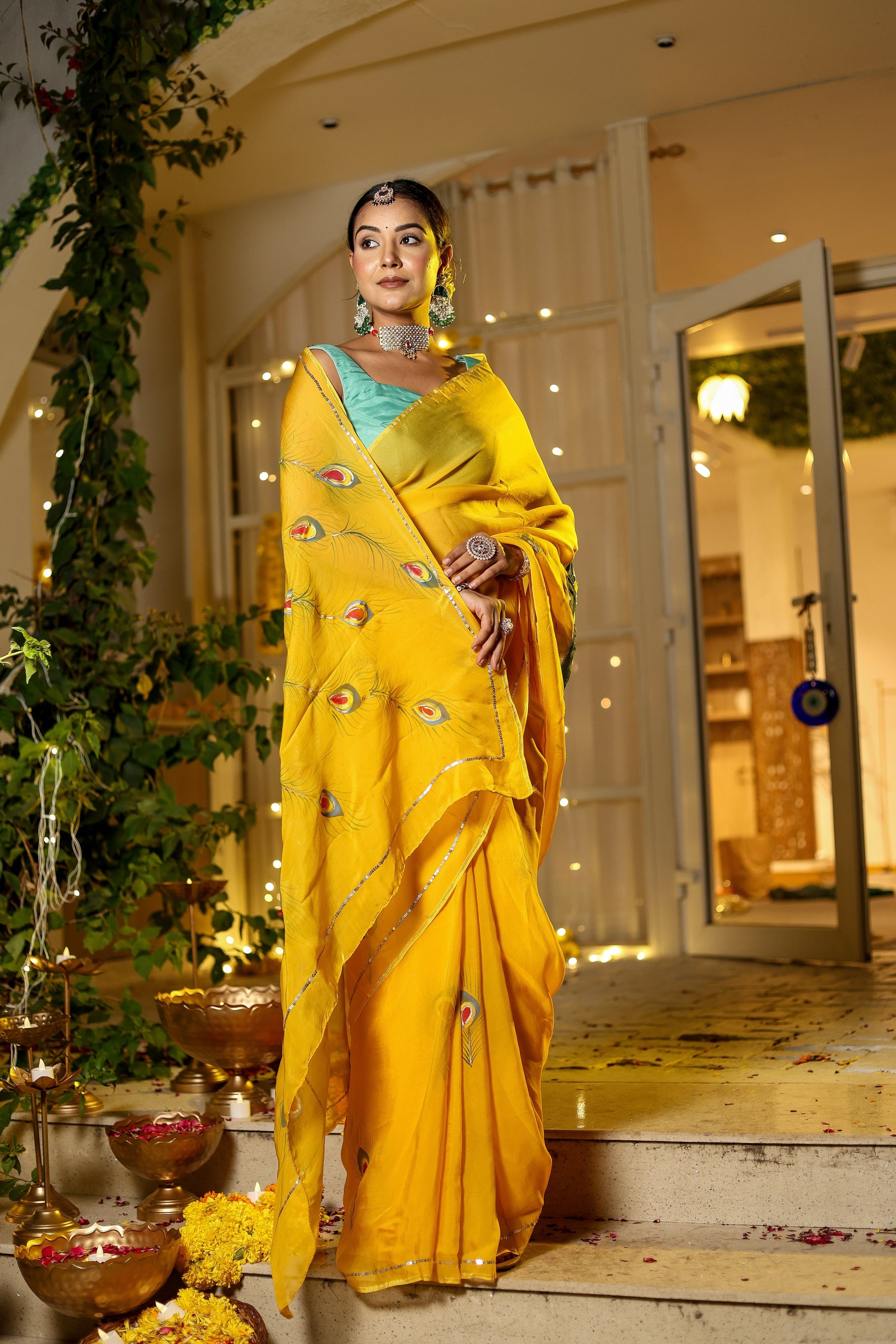 Beautiful model wearing a unique Indian saree with embroidery in vibrant yellow, styled elegantly for special occasions