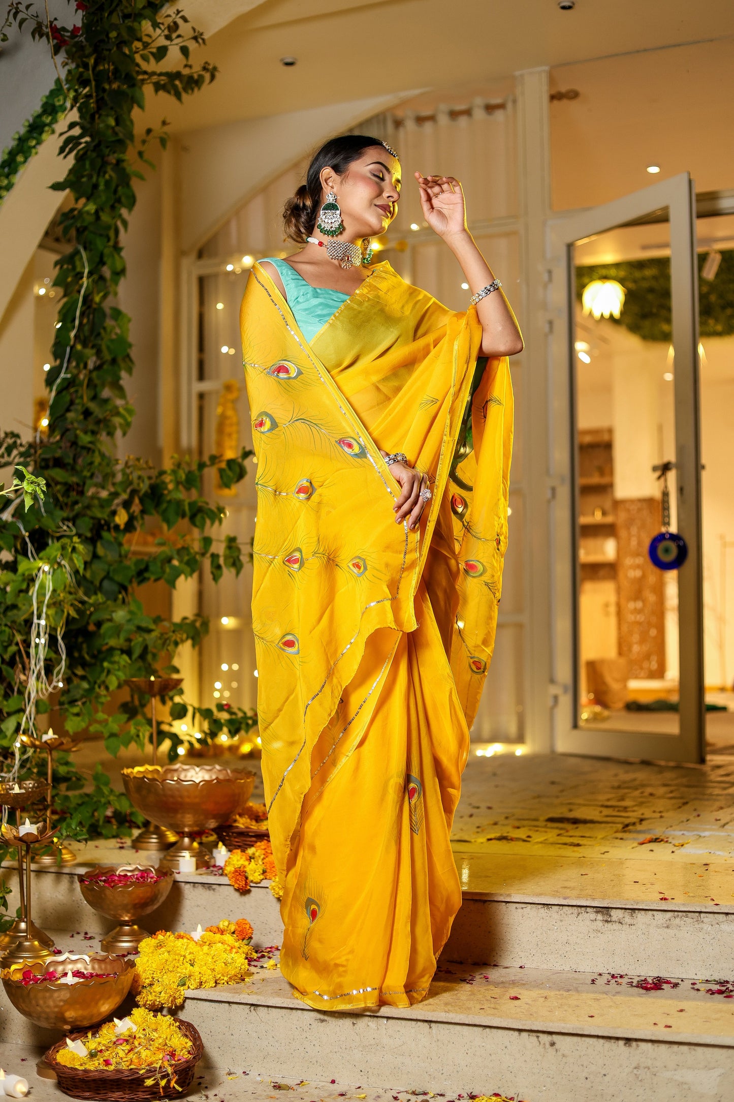 Stylera unique Indian saree with embroidery in vibrant yellow, styled elegantly outdoors