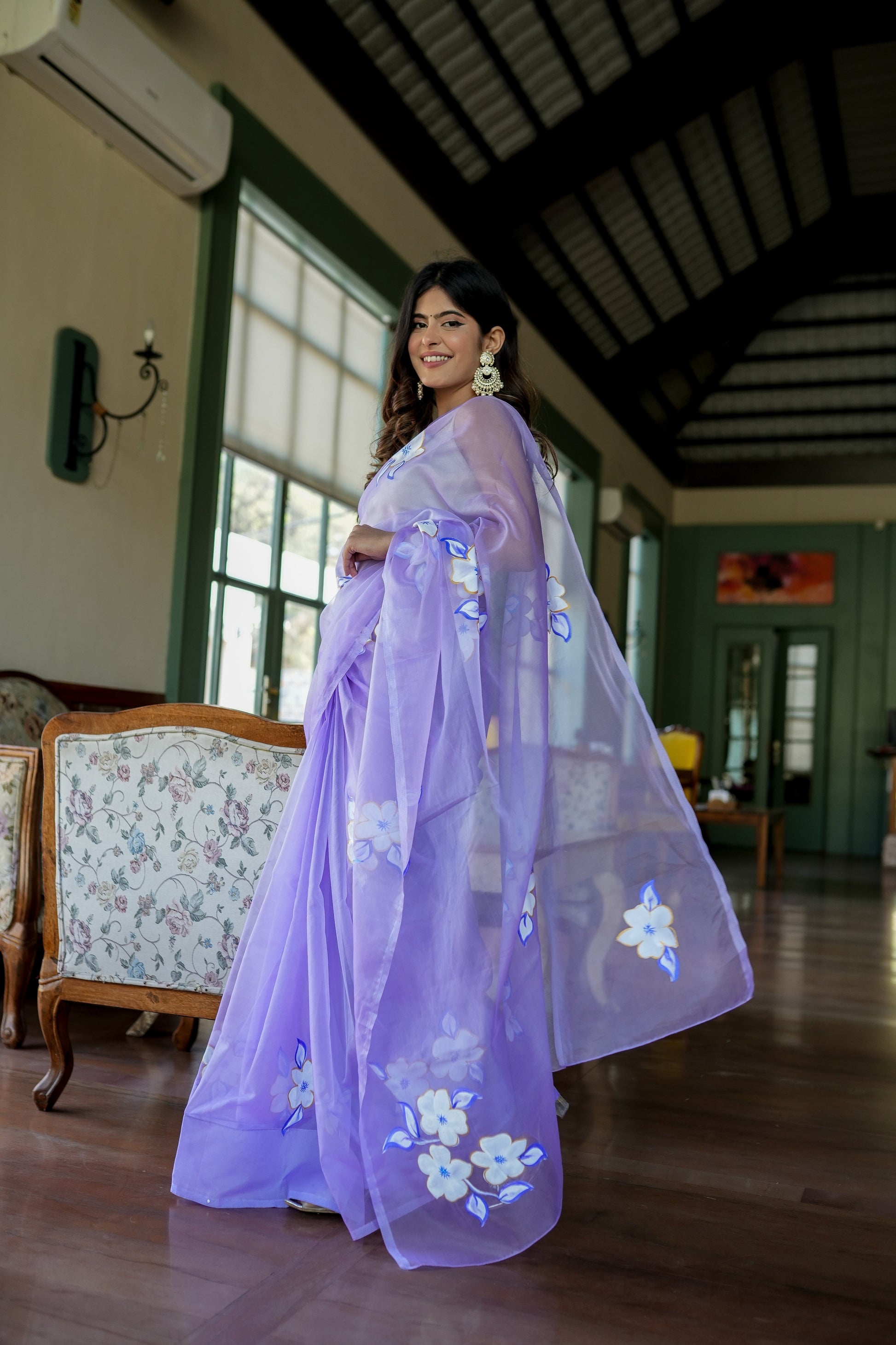 Stylera unique organza saree with artwork in lavender featuring floral designs and elegant draping