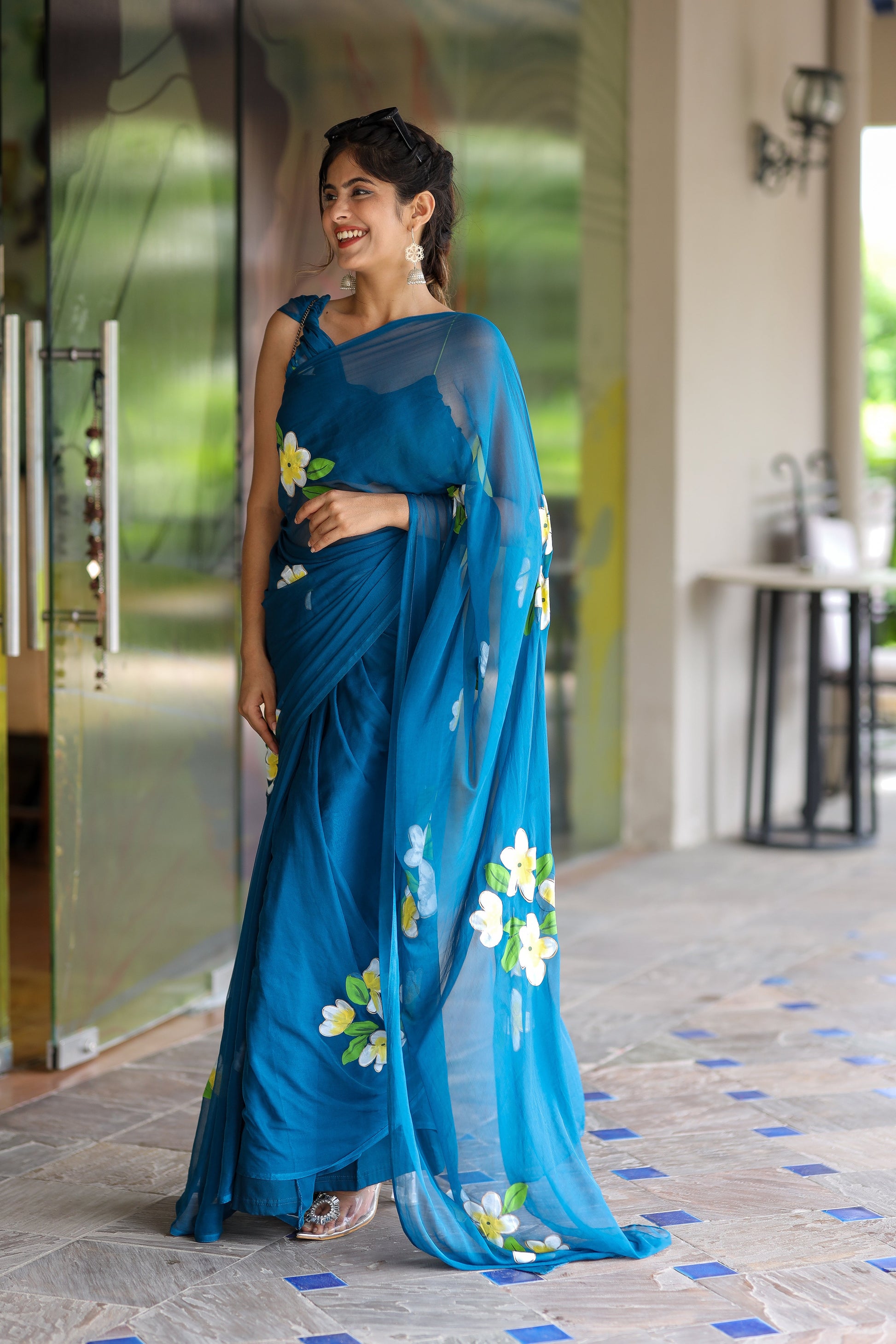 Stylera unique party wear saree in teal with floral embroidery for elegant celebrations