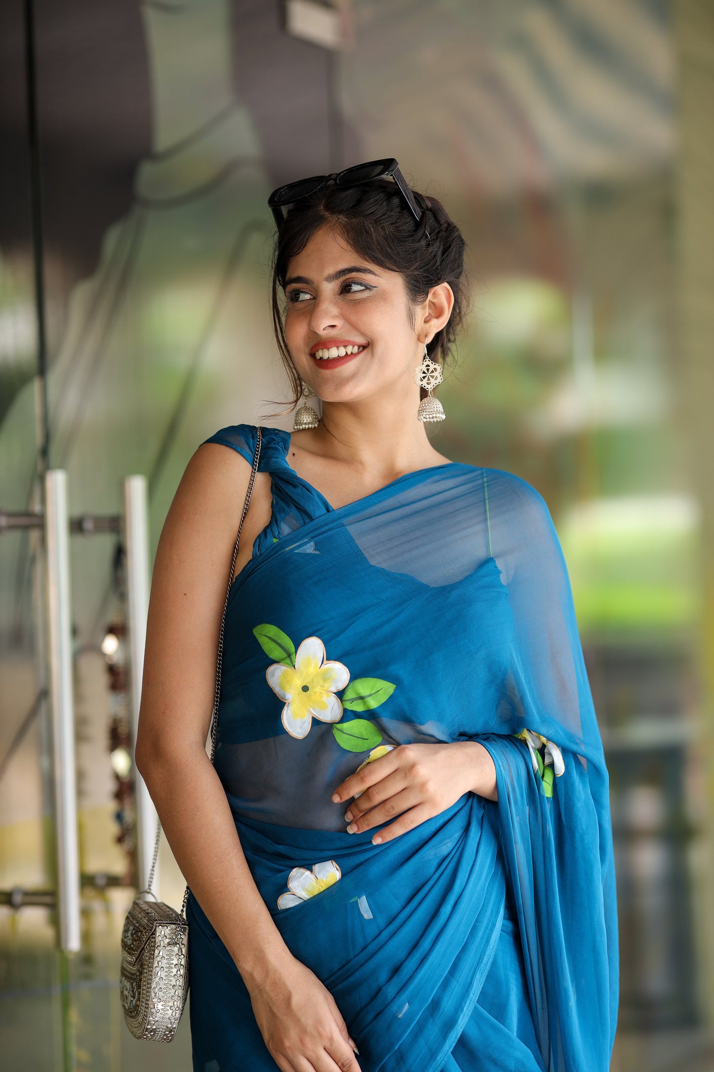 Elegant blue unique party wear saree with floral embroidery, perfect for festive occasions