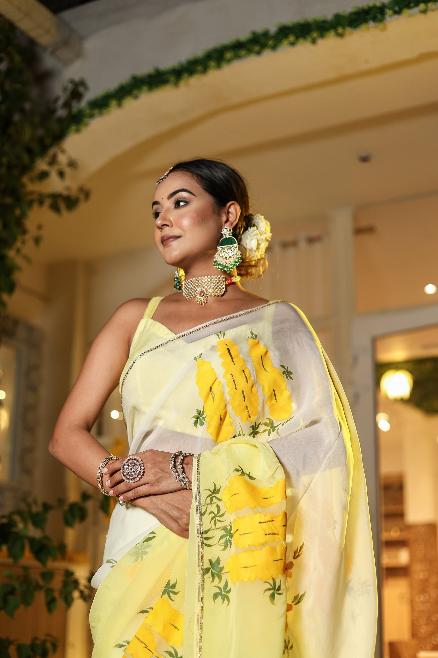 Elegant wedding organza saree yellow with floral patterns, styled for a festive occasion