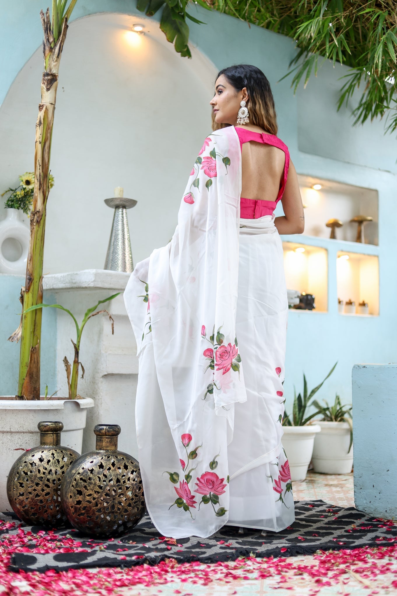 Elegant white floral saree for women with pink floral designs, styled for a chic look