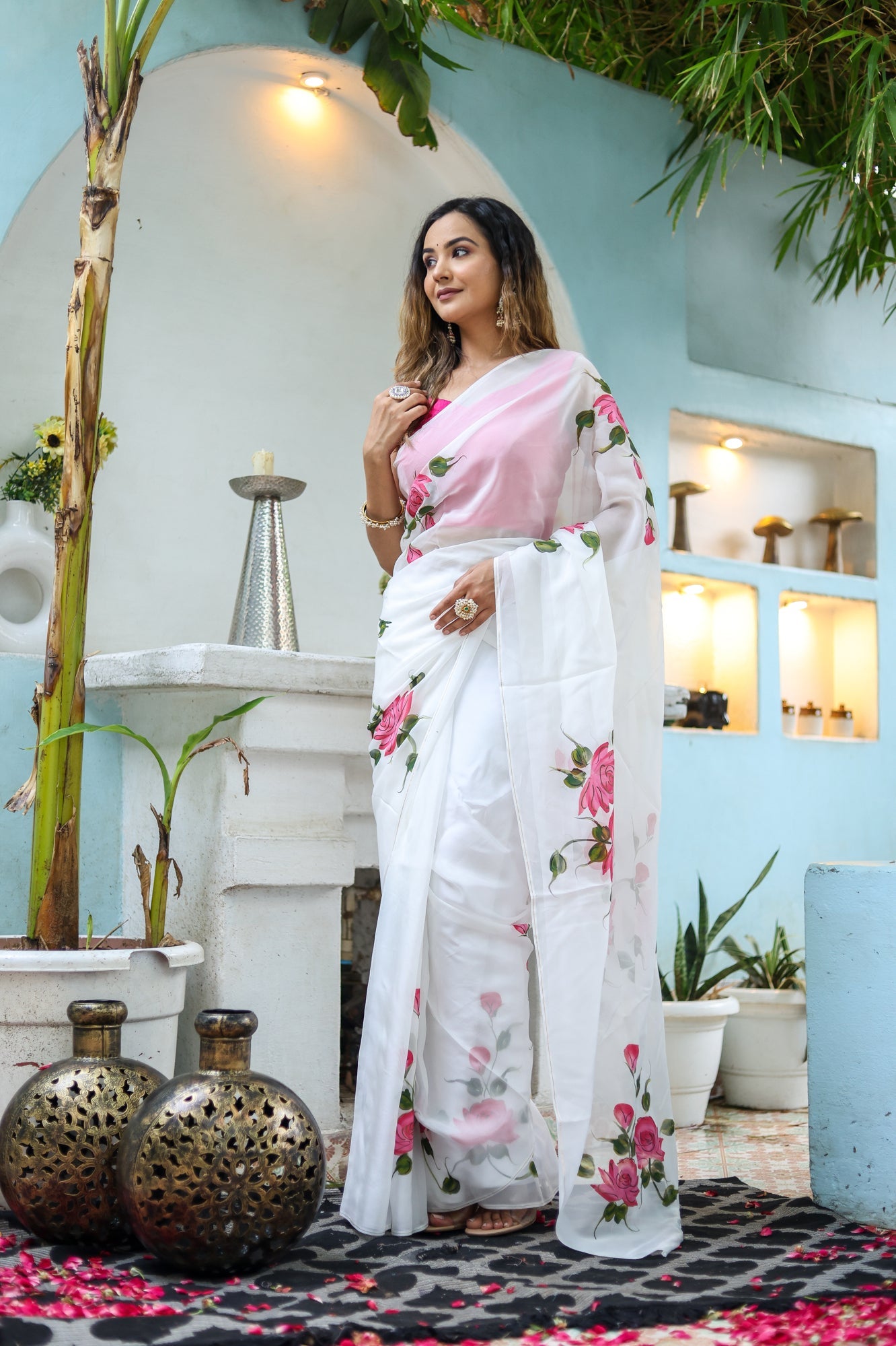 Elegant white floral saree for women with pink accents, perfect for festive occasions and celebrations