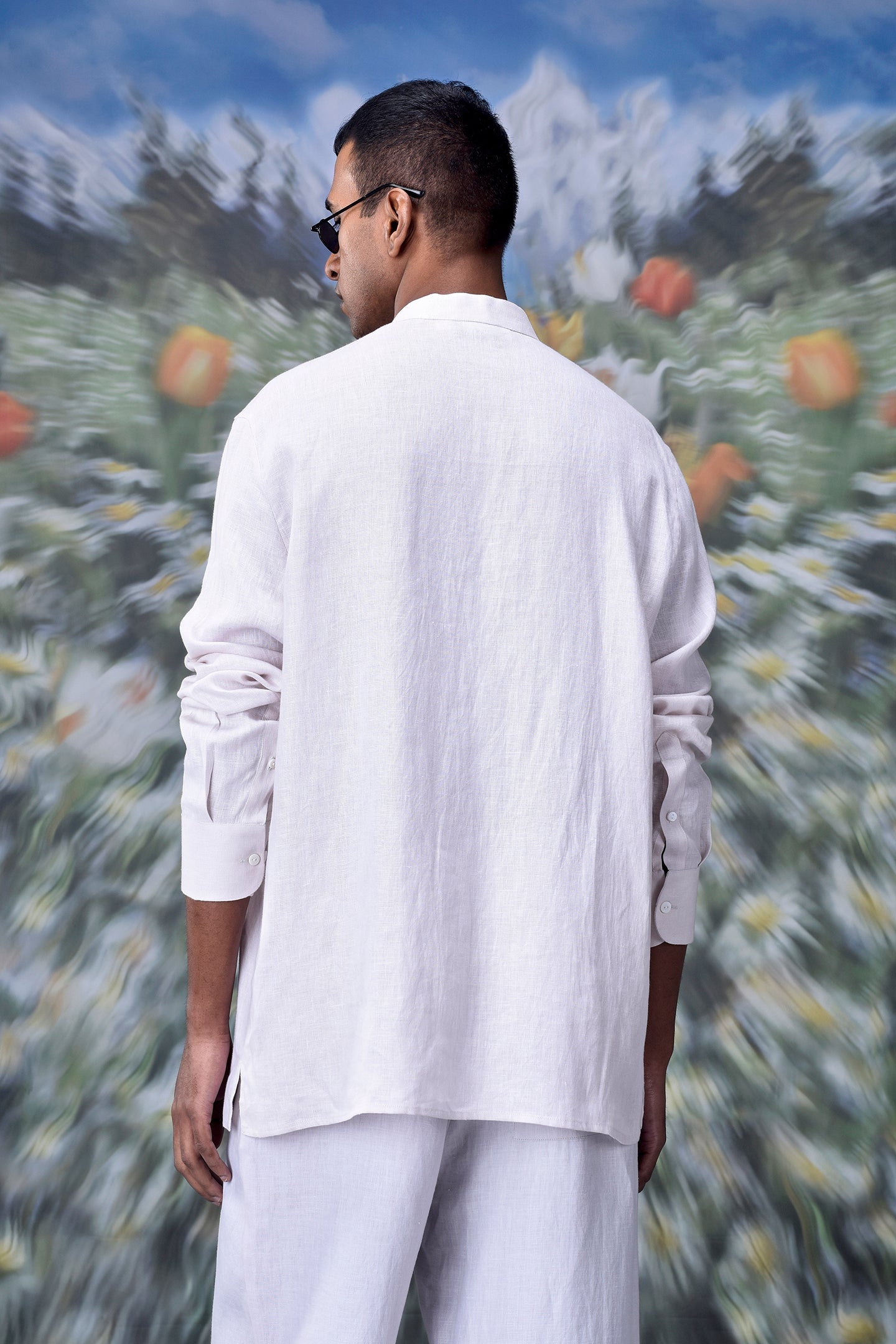 Model wearing a white linen casual shirt for men by Stylera relaxed fit back view