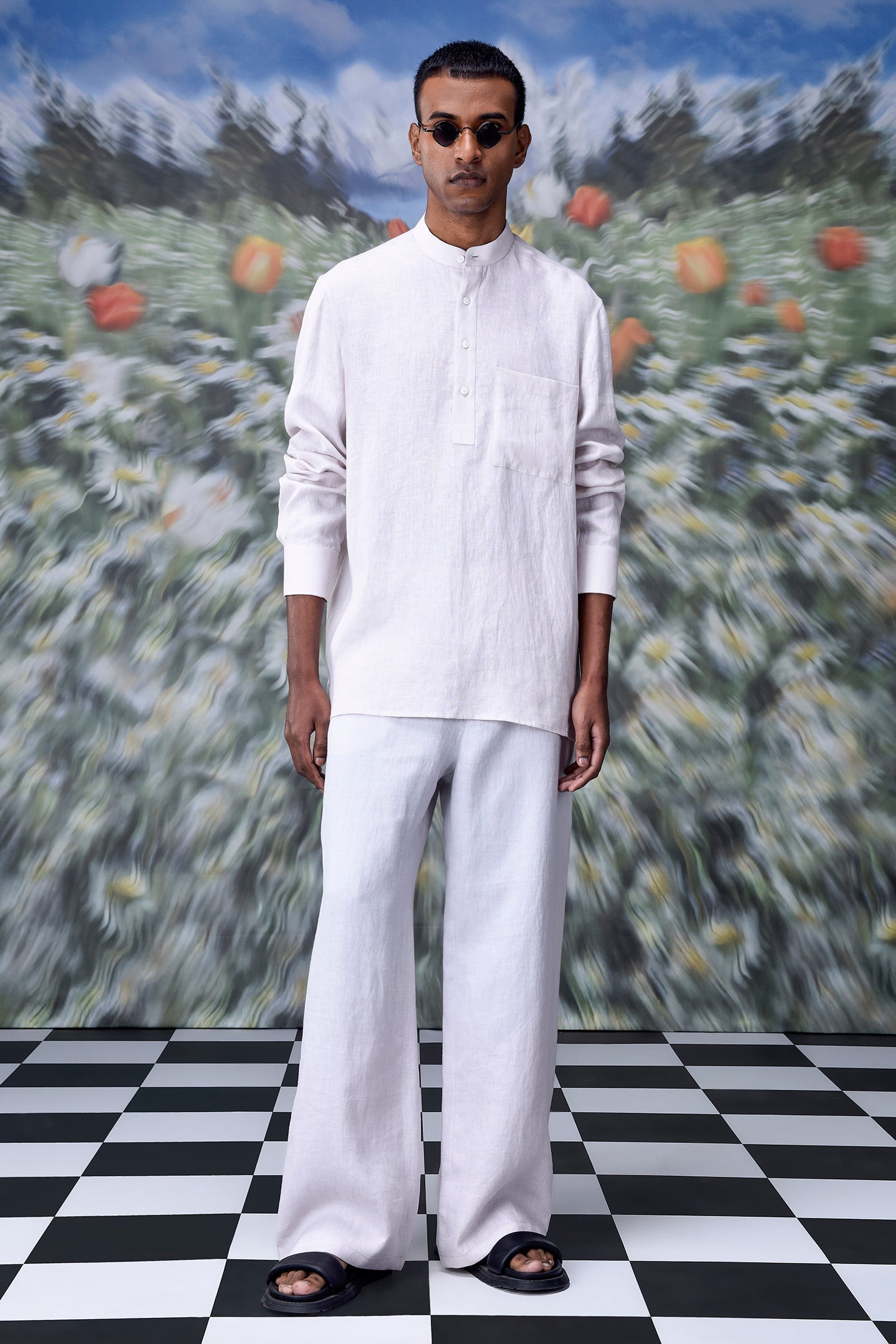 Stylera model wearing a white linen casual shirt for men with mandarin collar and chest pocket