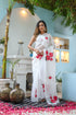 Elegant white organza saree for women featuring vibrant floral prints and graceful draping style