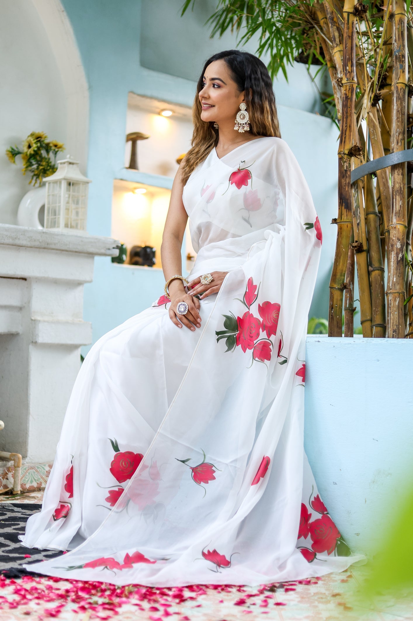 Elegant white organza saree for women featuring vibrant floral designs, perfect for special occasions.