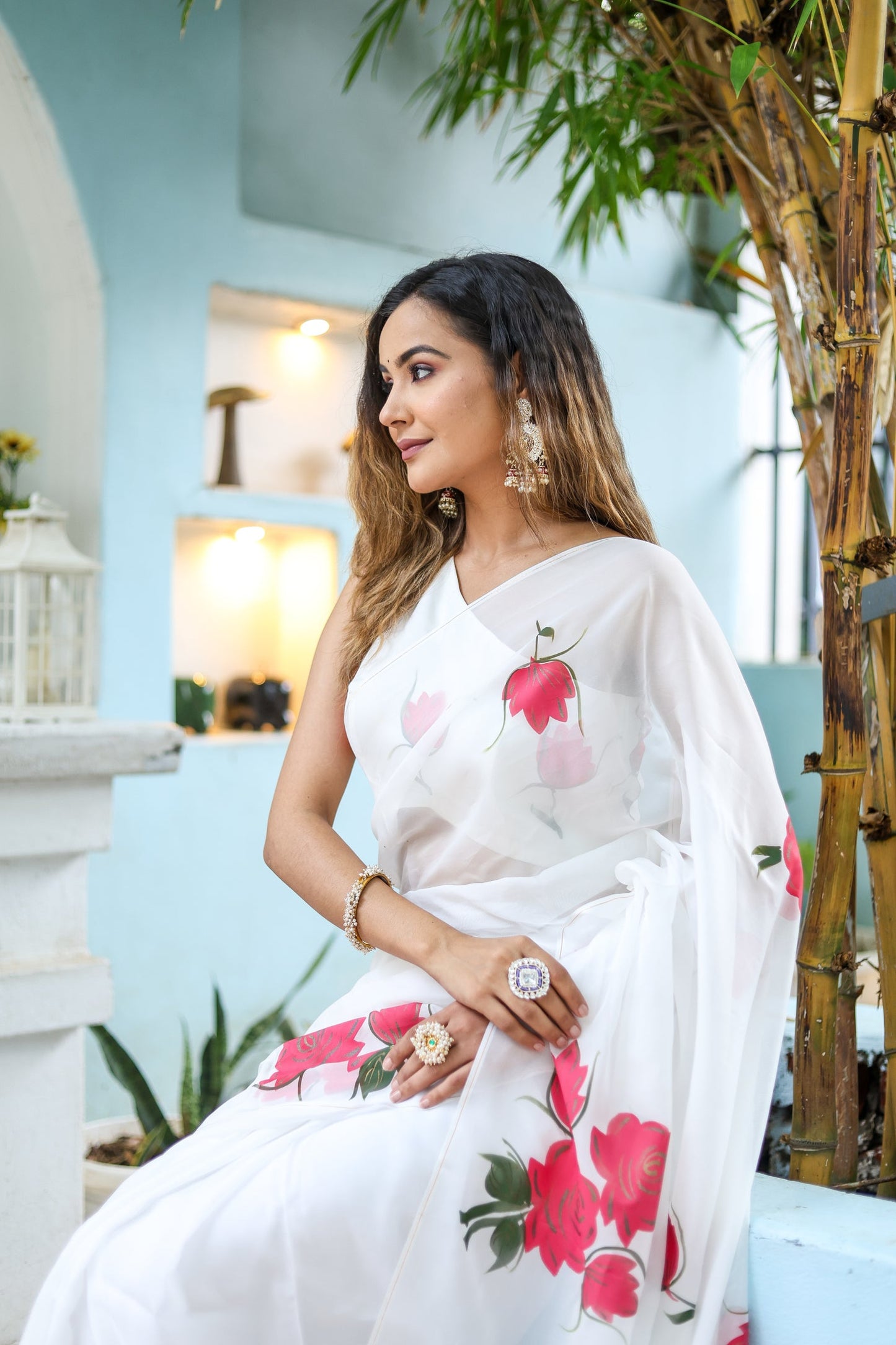 Elegant white organza saree for women with floral prints, perfect for festive occasions