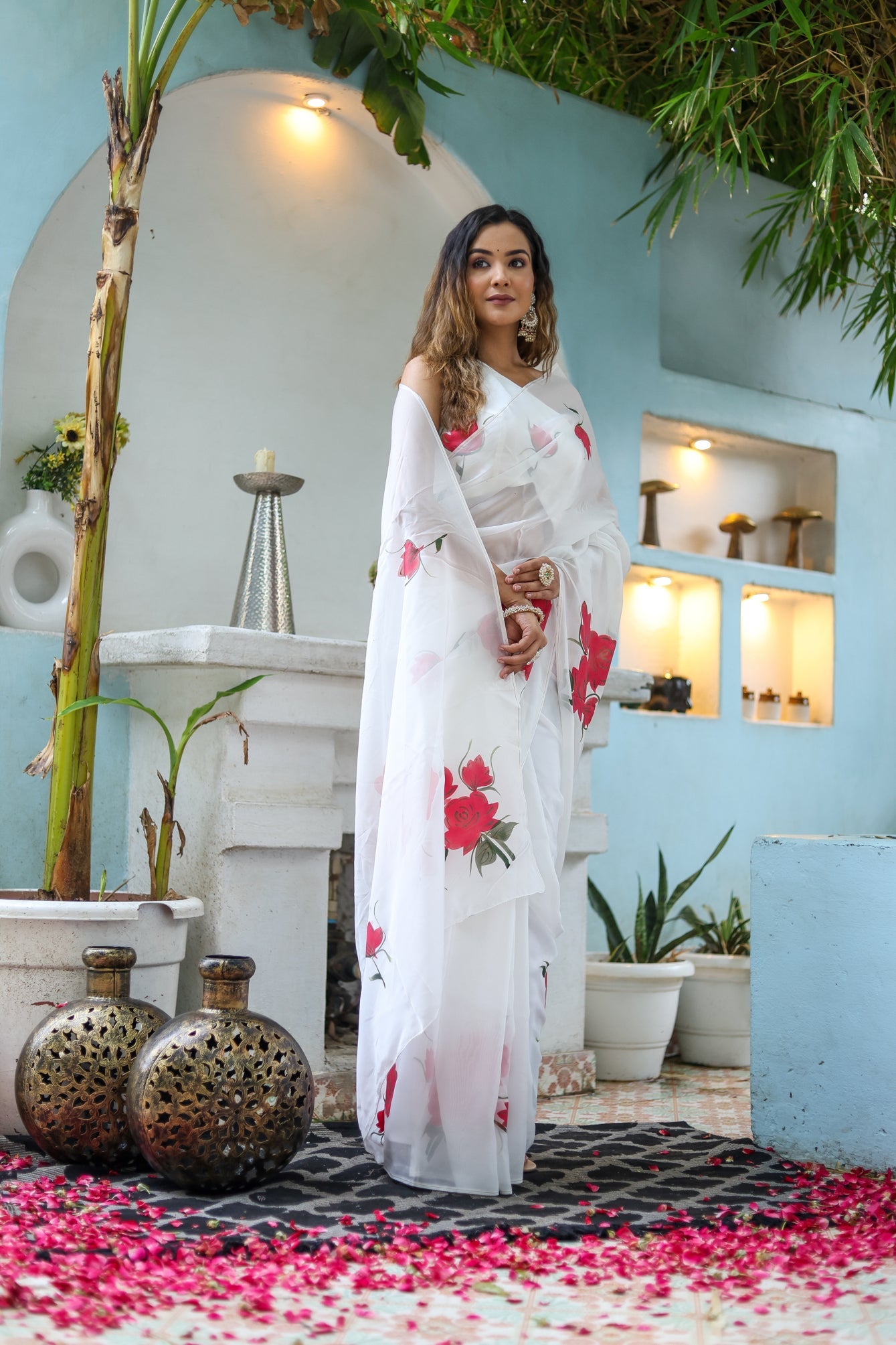 Elegant white organza saree for women adorned with floral designs, perfect for festive occasions