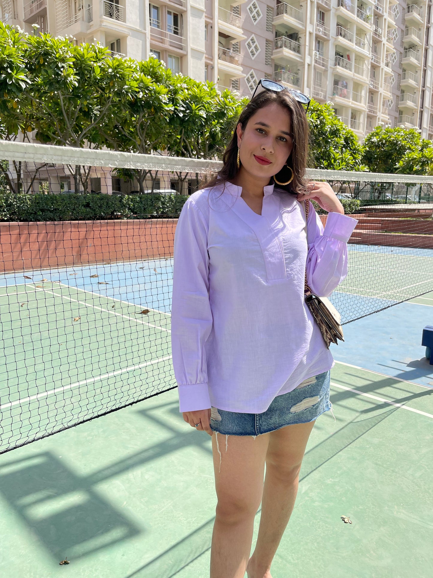 Stylera women's trendy summer tops in light purple, perfect for casual outings with denim shorts