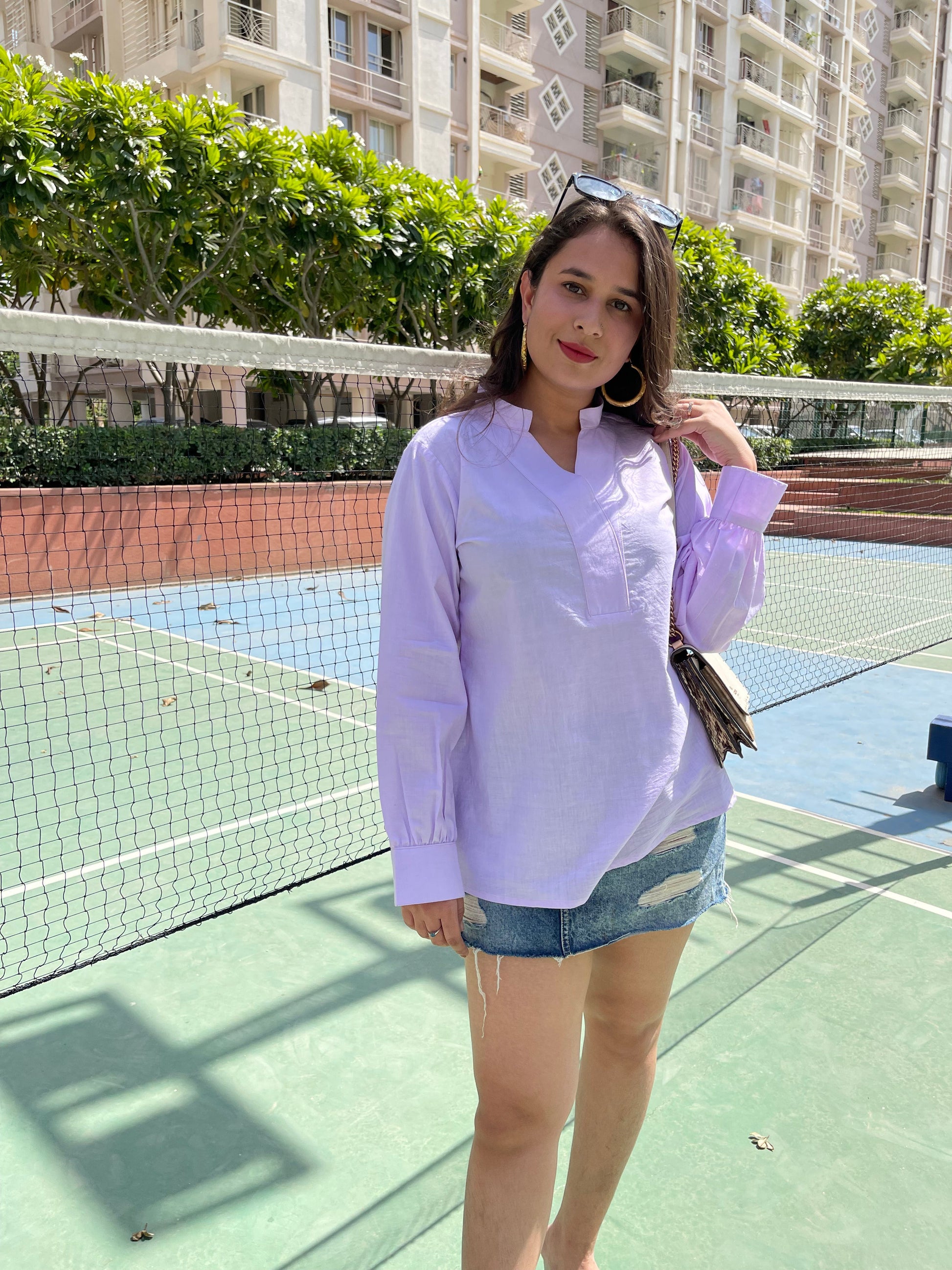 Stylera women's trendy summer tops in light purple, perfect for casual outings with denim shorts