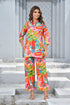 Vibrant women’s tropical print co-ord set featuring a colorful top and matching wide-leg pants