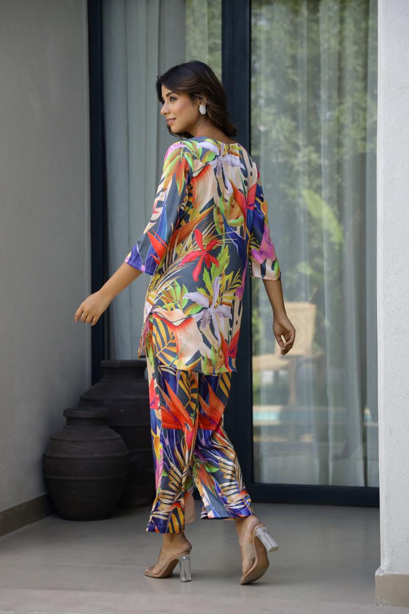 Model wearing a women's vibrant nightwear set with colorful floral patterns and stylish design