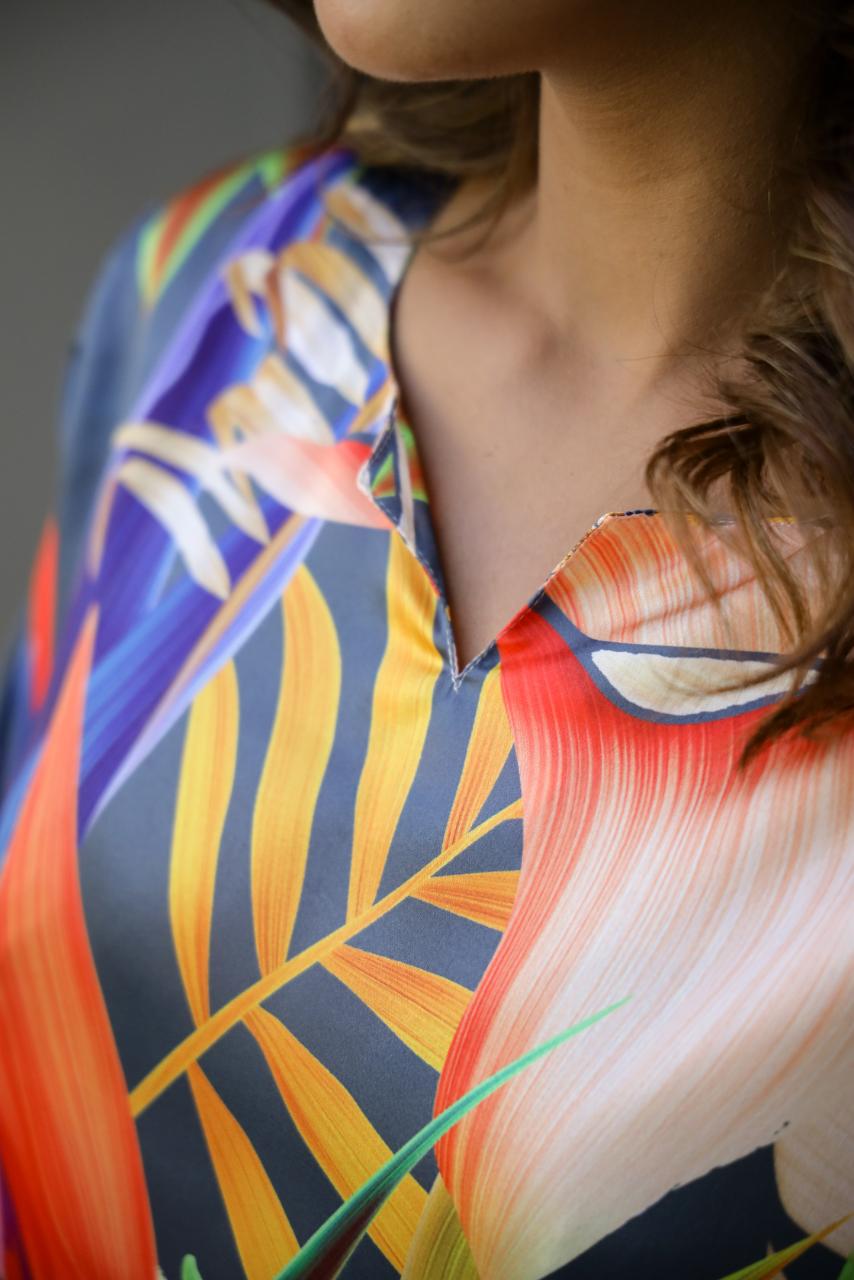 Close-up of women's vibrant nightwear set with colorful floral design and elegant neckline