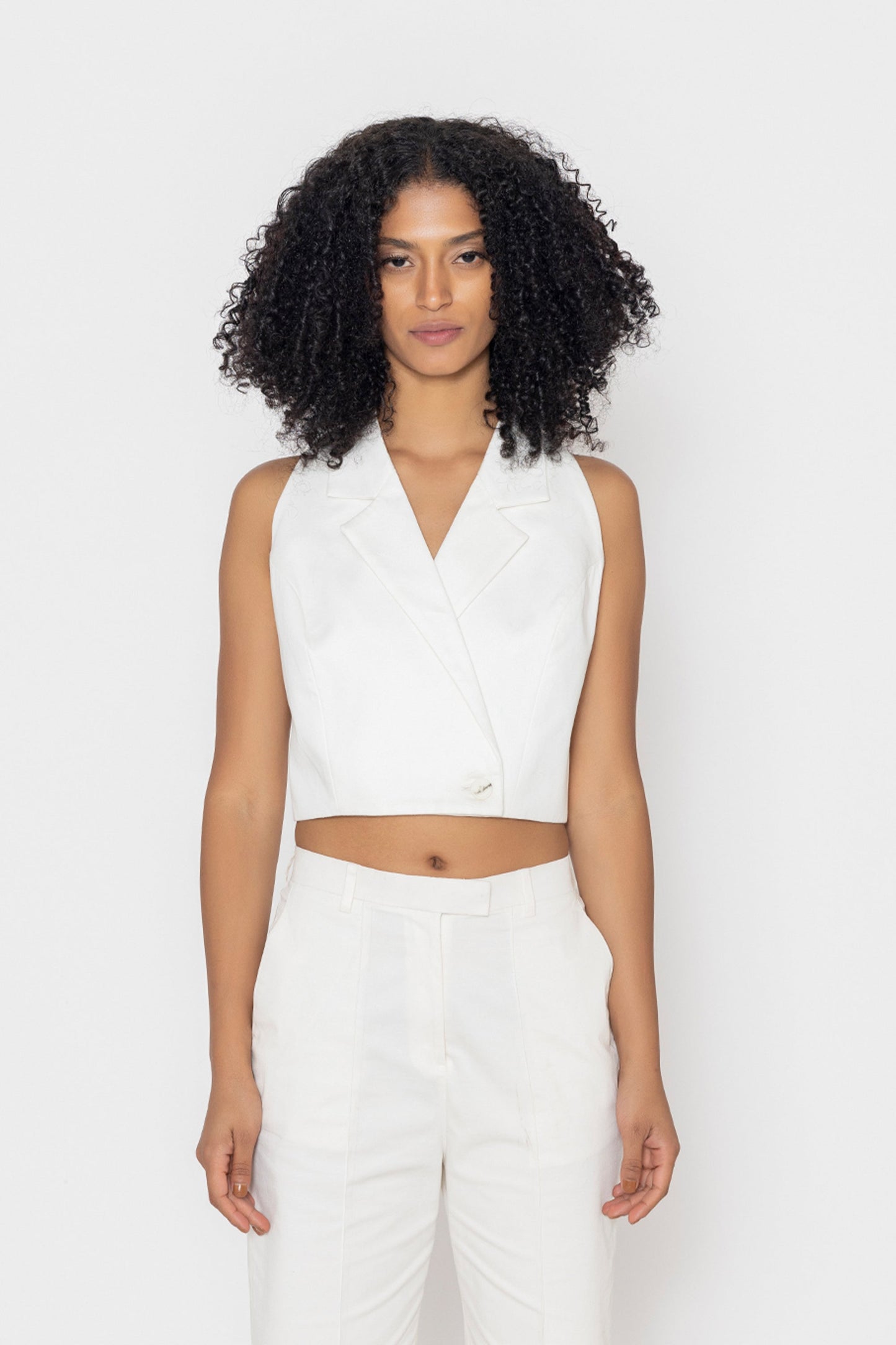 Stylera women's white vest top with sleeveless blazer design and cropped fit