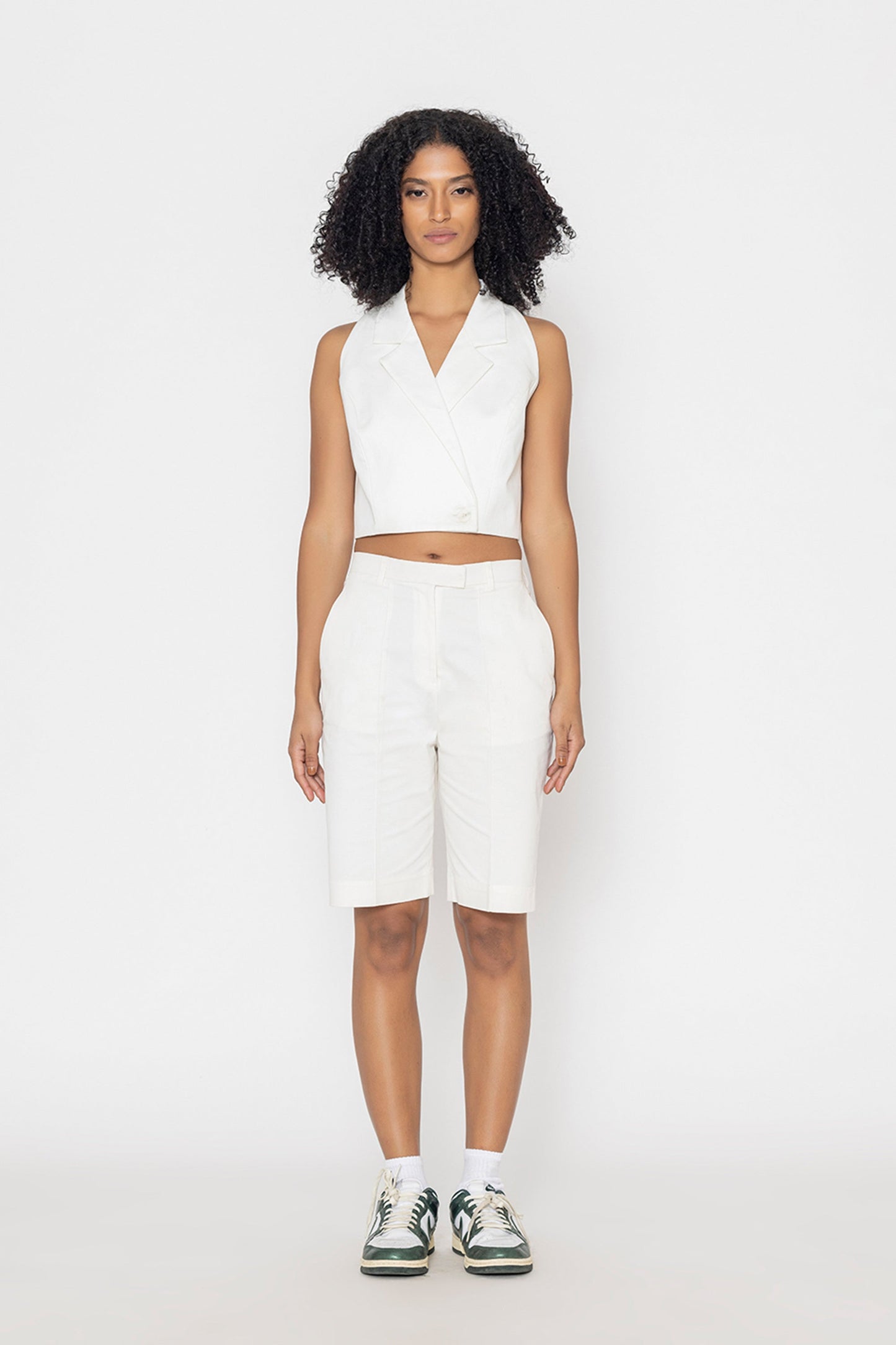 Stylera women's white vest top sleeveless cropped style paired with white shorts