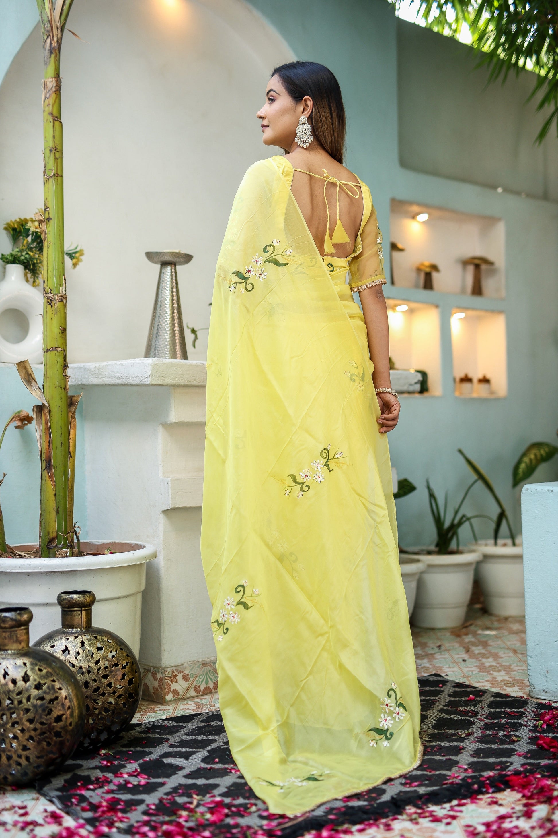 Elegant yellow floral organza saree with intricate embroidery, perfect for special occasions