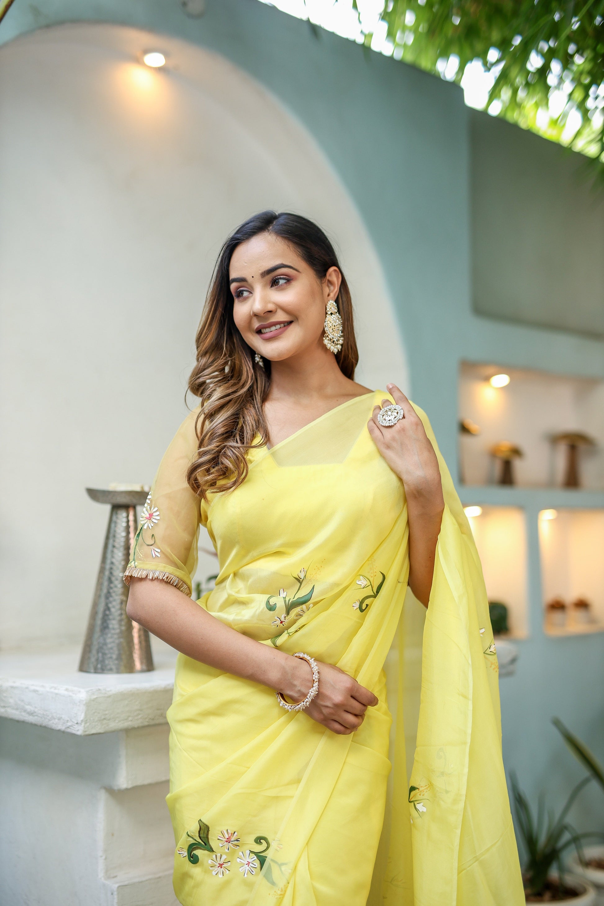 Stylera yellow floral organza saree with elegant embroidery and delicate detailing