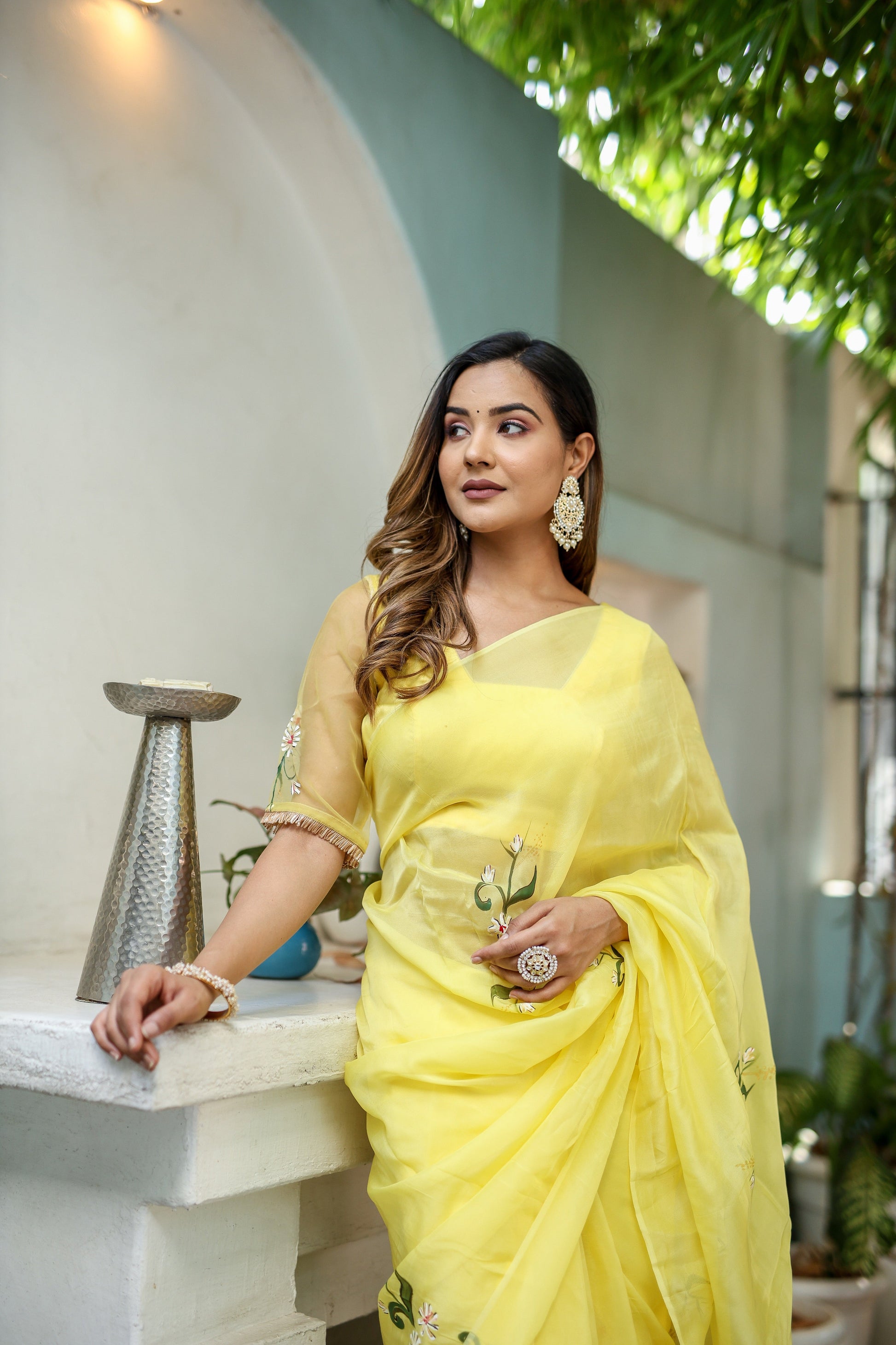 Elegant yellow floral organza saree by Stylera , perfect for festive occasions and celebrations