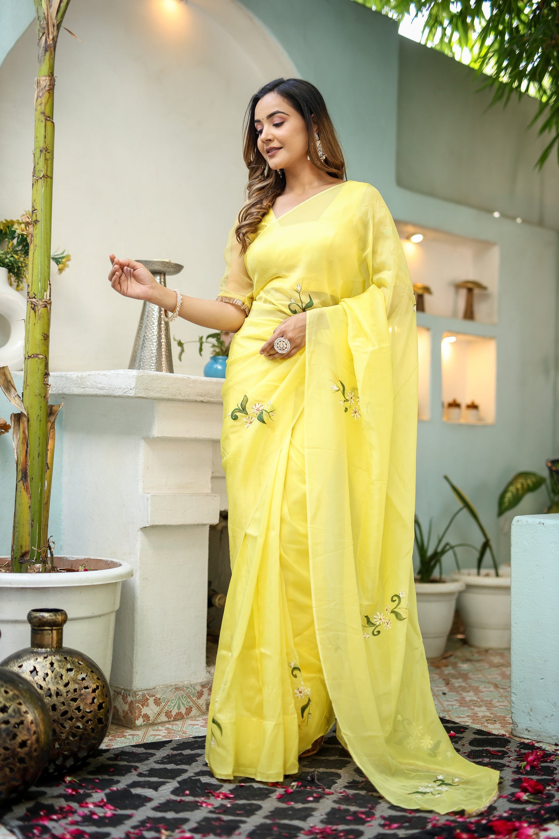 Elegant yellow floral organza saree from Stylera, perfect for festive occasions