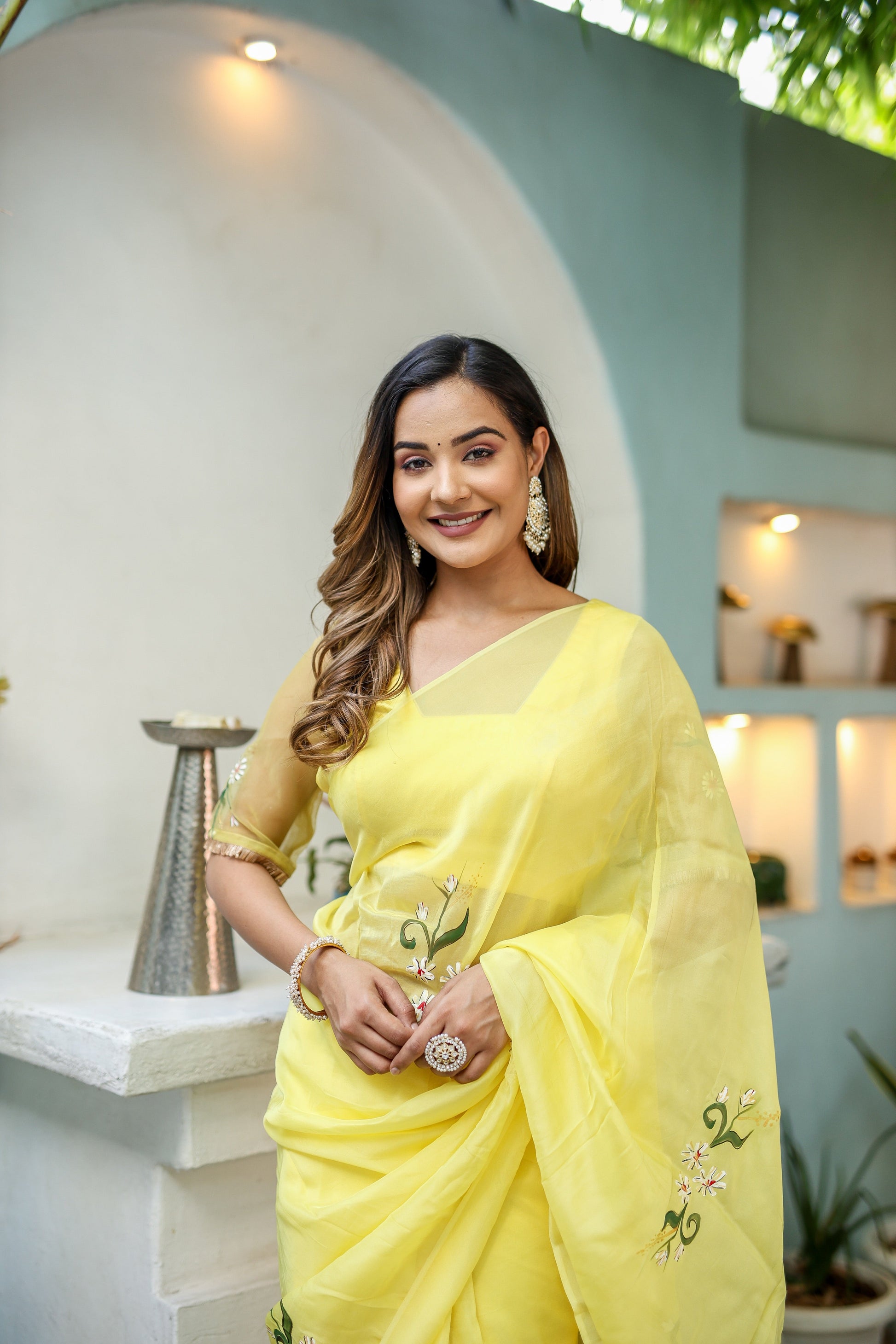 Elegant yellow floral organza saree with intricate embroidery, perfect for festive occasions