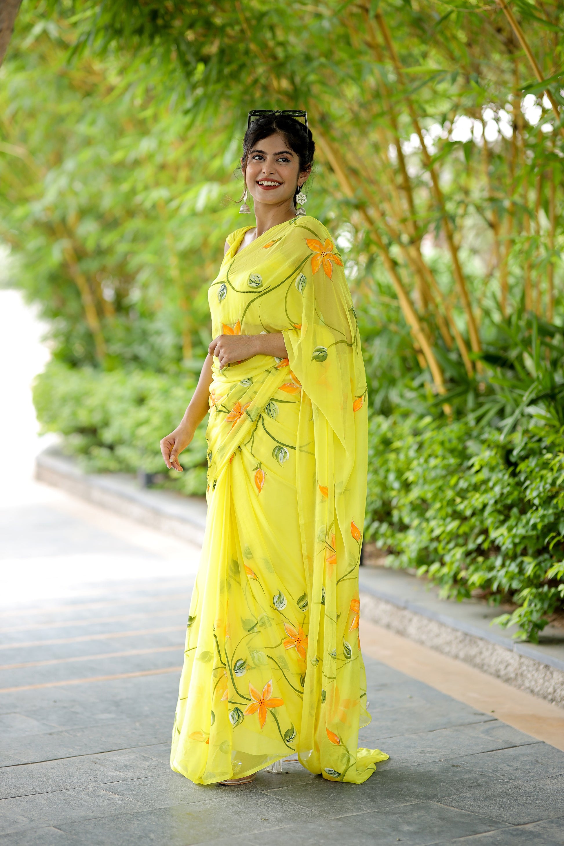 Stylera yellow saree with floral print, featuring vibrant flowers and elegant draping for festive occasions