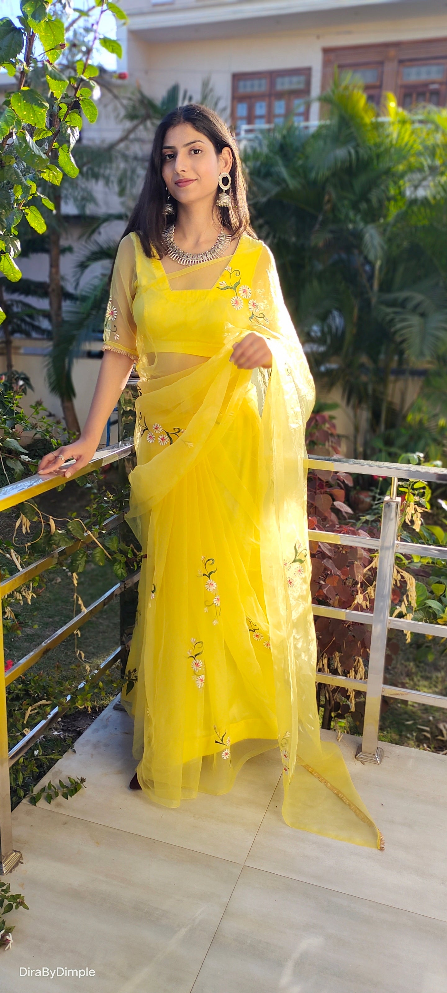 Yellow sunflower saree with delicate floral embroidery, perfect for festive occasions