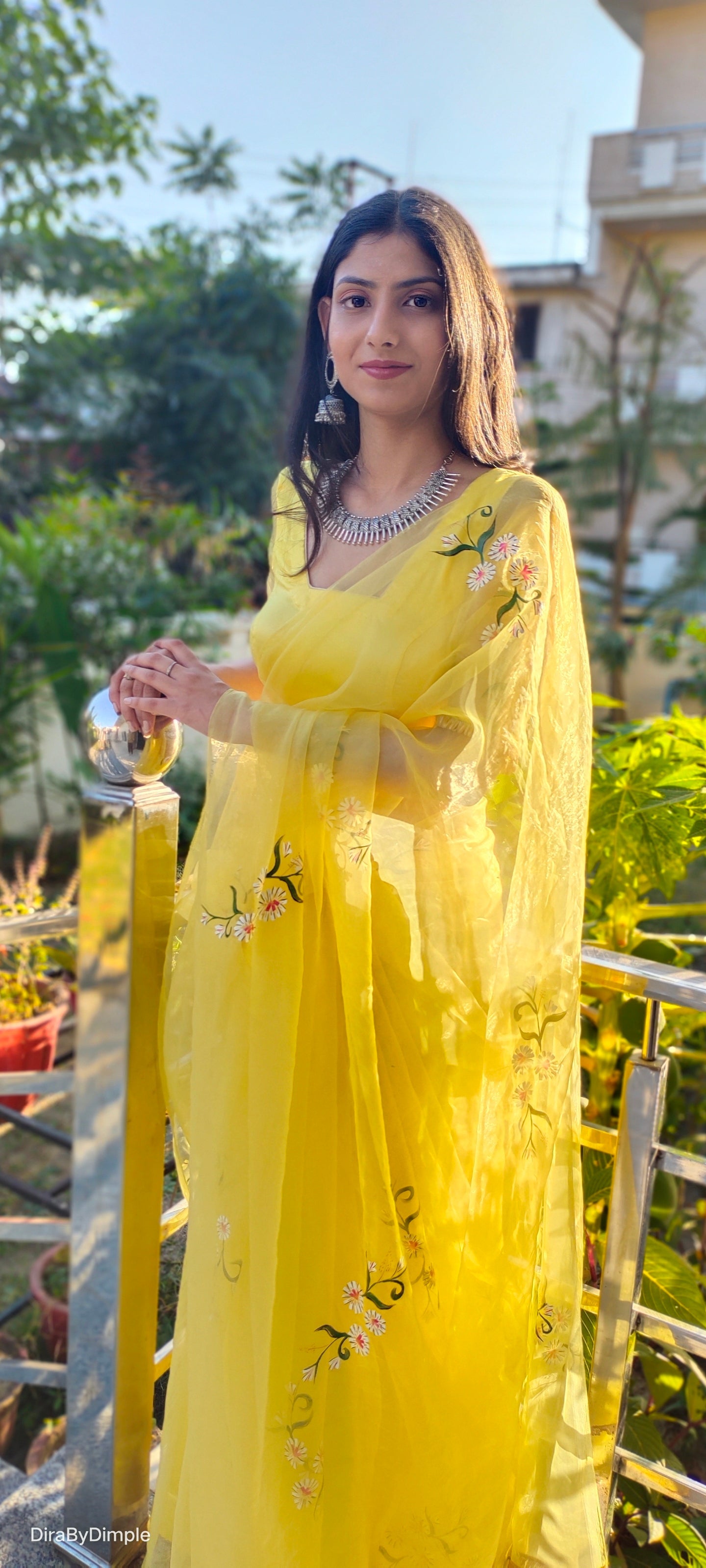 Elegant yellow sunflower saree from DiraByDimple, adorned with floral embroidery and a sheer dupatta
