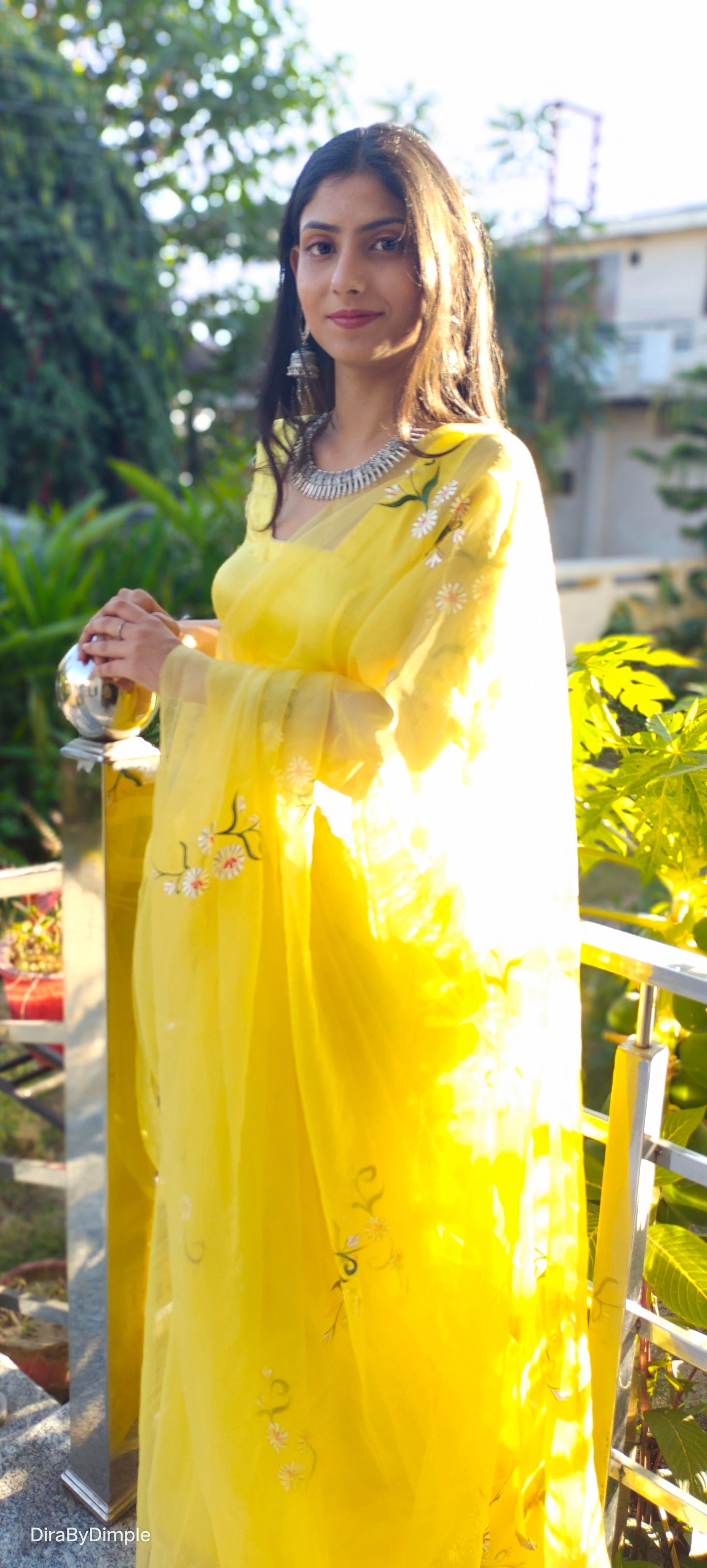 Elegant yellow sunflower saree with floral embroidery, perfect for festive occasions and celebrations.