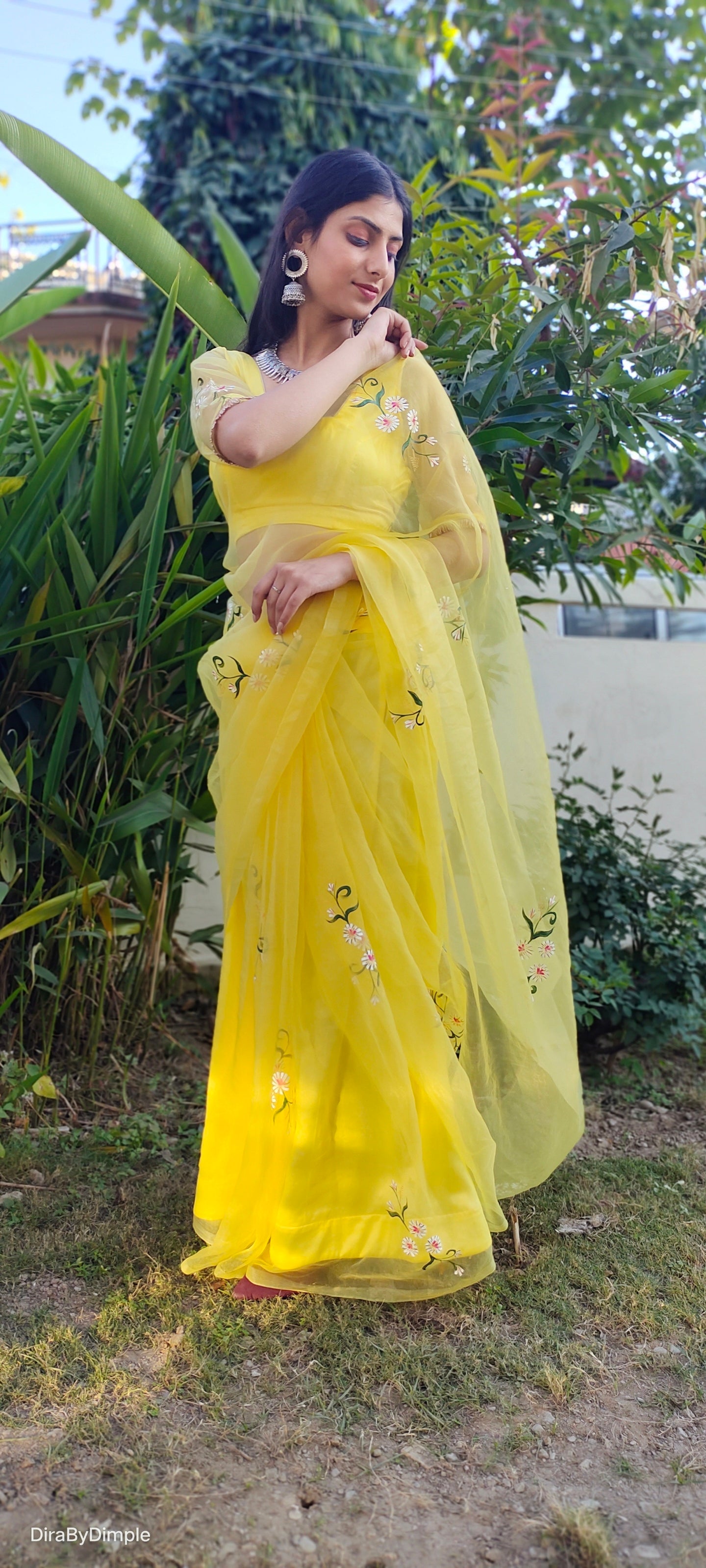 Yellow sunflower saree with floral embroidery perfect for festive occasions and elegant gatherings