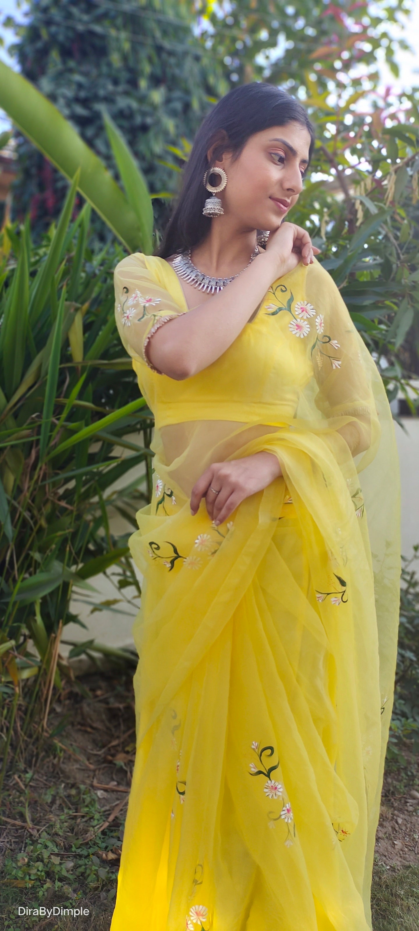 Elegant yellow sunflower saree with floral embroidery, perfect for festive occasions or casual wear
