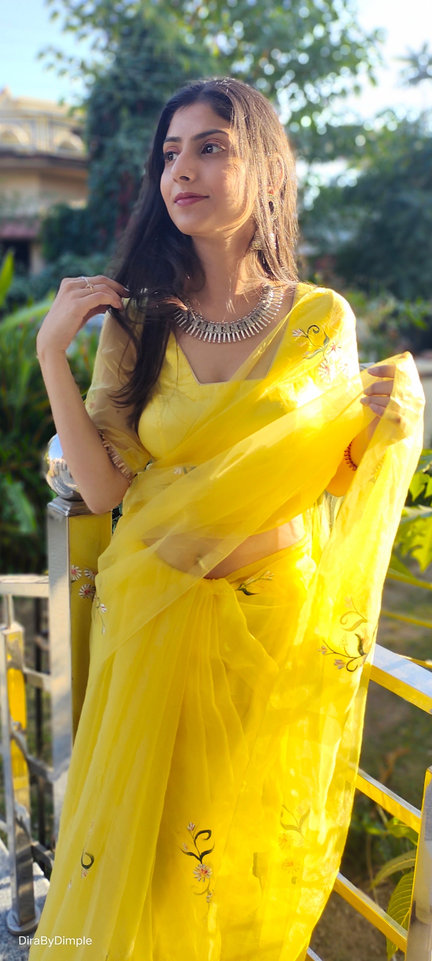 Elegant yellow sunflower saree featuring intricate embroidery, perfect for festive occasions