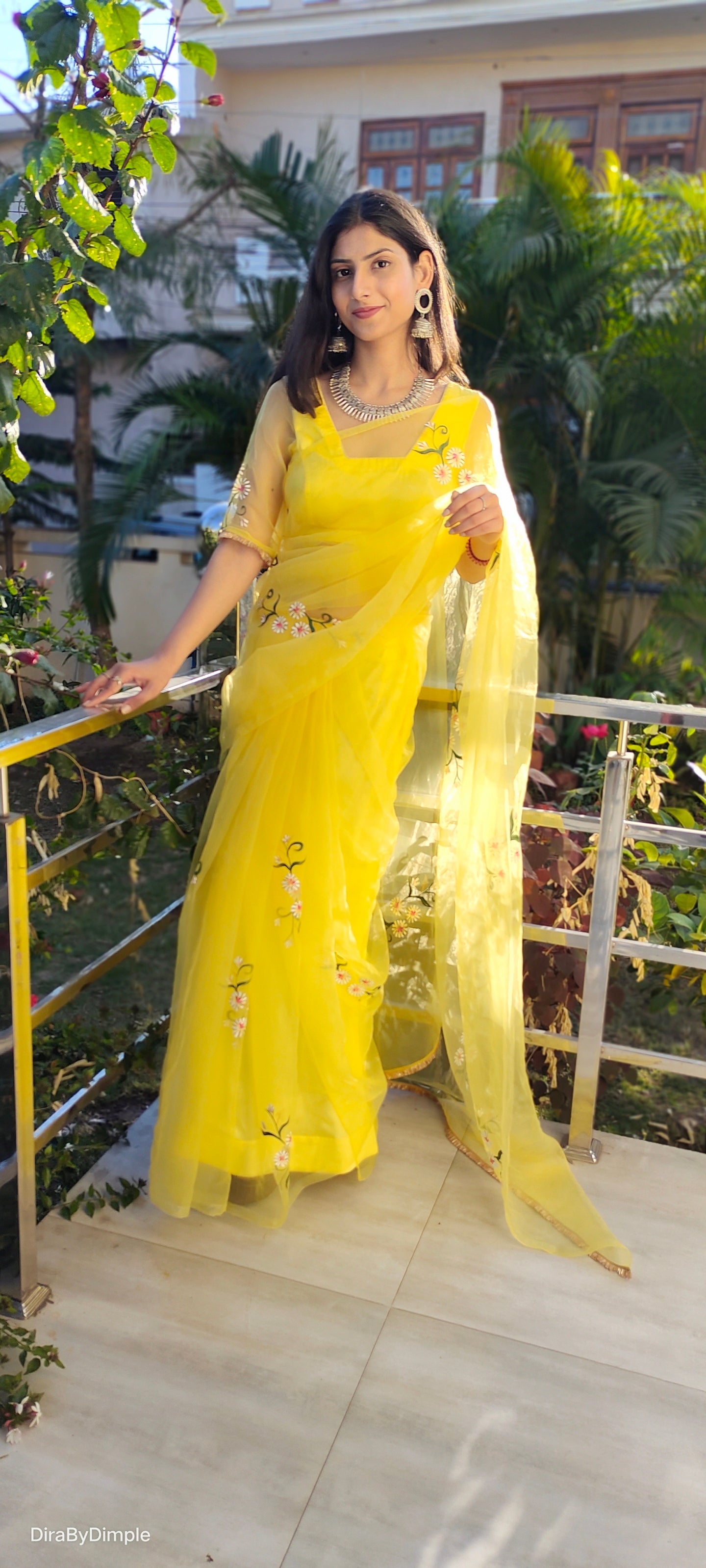 Elegant yellow sunflower saree with delicate floral embroidery, perfect for festive occasions
