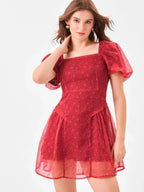 Female model wearing a princess cut square neck red dress from Stylera