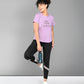 A woman in workout clothes smiles and poses with a water bottle, wearing the Pilates Pink T-shirt—a soft, stylish cotton-modal tee that's perfect for women seeking comfort and flair during Pilates workouts.