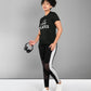 Woman in activewear holding headphones, wearing the Pilates Black T-shirt featuring a "Live Love Pilates" print, standing against a plain background.