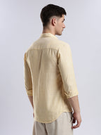 Minimalist pale yellow linen-blend button-up shirt for men, perfect for smart-casual spring layering.