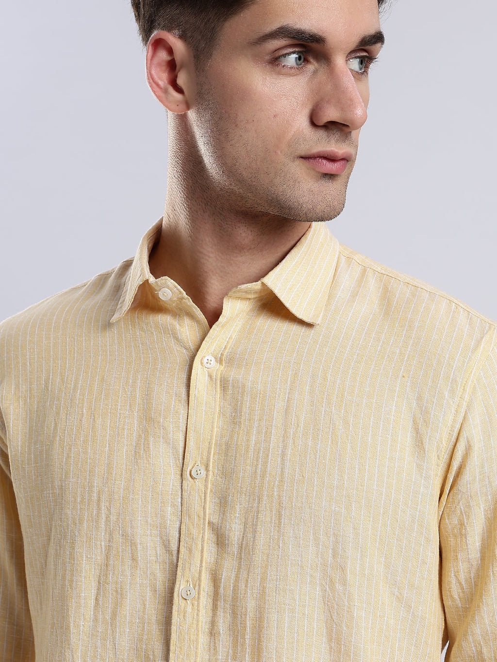 Stylera pastel yellow long-sleeve utility shirt with a structured spread collar and white buttons.