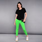 Woman in a 'Pilates Has Your Back' Printed Tee and bright green leggings, holding a water bottle and standing against a gray background.
