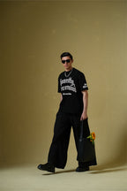 Nevermind Printed Black Oversized T-Shirt Main Character