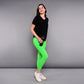 Woman in a 'Pilates Has Your Back' printed tee and bright green leggings holding a water bottle, standing against a gray background.