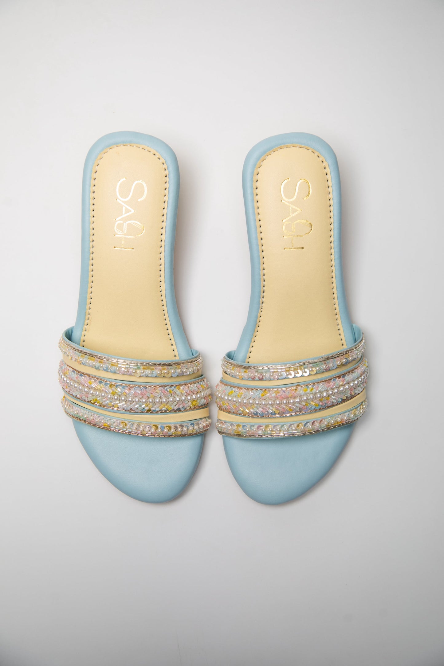 Powder Blue round 2 inch heels with slide straps of intrictae pastel pink, yellow and blue handwork with pearls