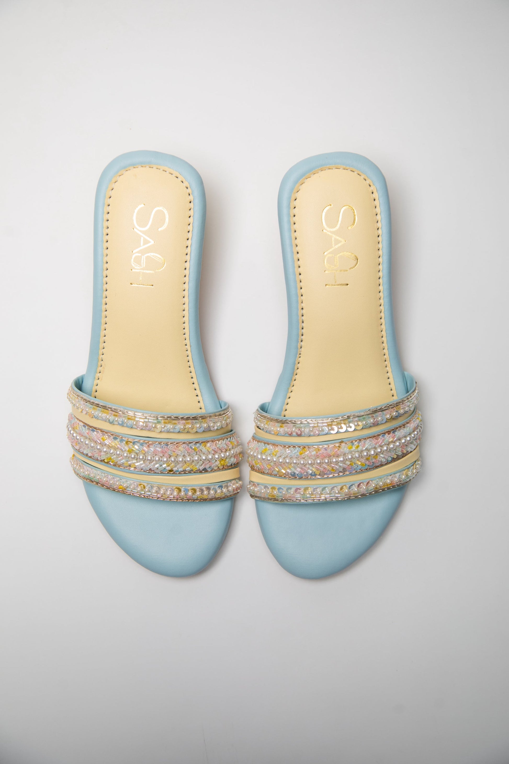 Powder Blue round 2 inch heels with slide straps of intrictae pastel pink, yellow and blue handwork with pearls