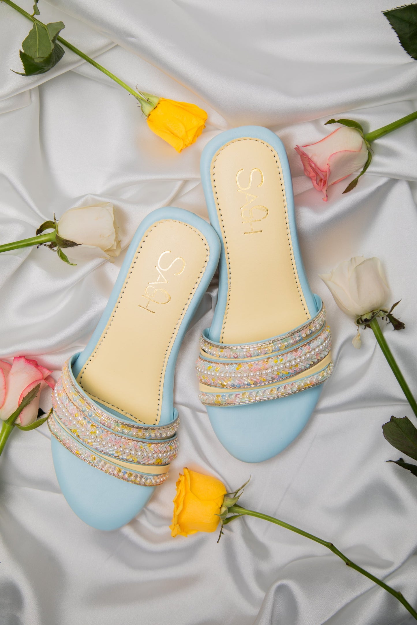 Powder Blue round 2 inch heels with slide straps of intrictae pastel pink, yellow and blue handwork with pearls